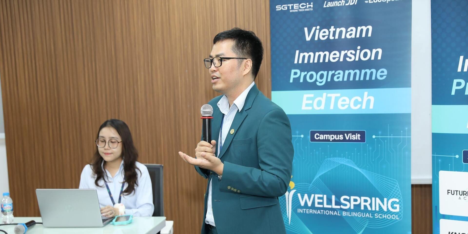 Wellspring representative welcoming the Singapore delegation (Photo: JDI)